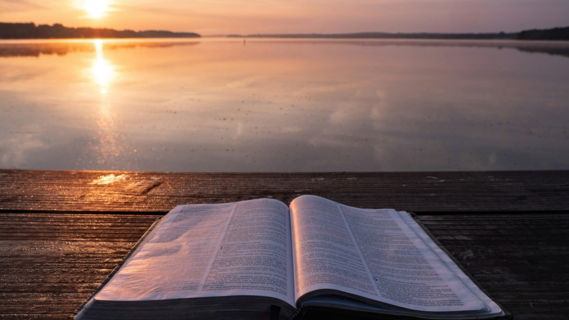 book-on-top-of-table-and-body-of-water.jpg book on top of table and body of water